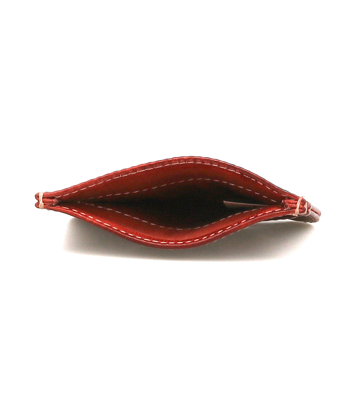 A top view of the empty Chuck wallet by Bed|Stü in red leather with white stitching, showing the inside compartment—perfect for those seeking a compact card wallet for everyday carry.