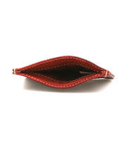 A top view of the empty Chuck wallet by Bed|Stü in red leather with white stitching, showing the inside compartment—perfect for those seeking a compact card wallet for everyday carry.