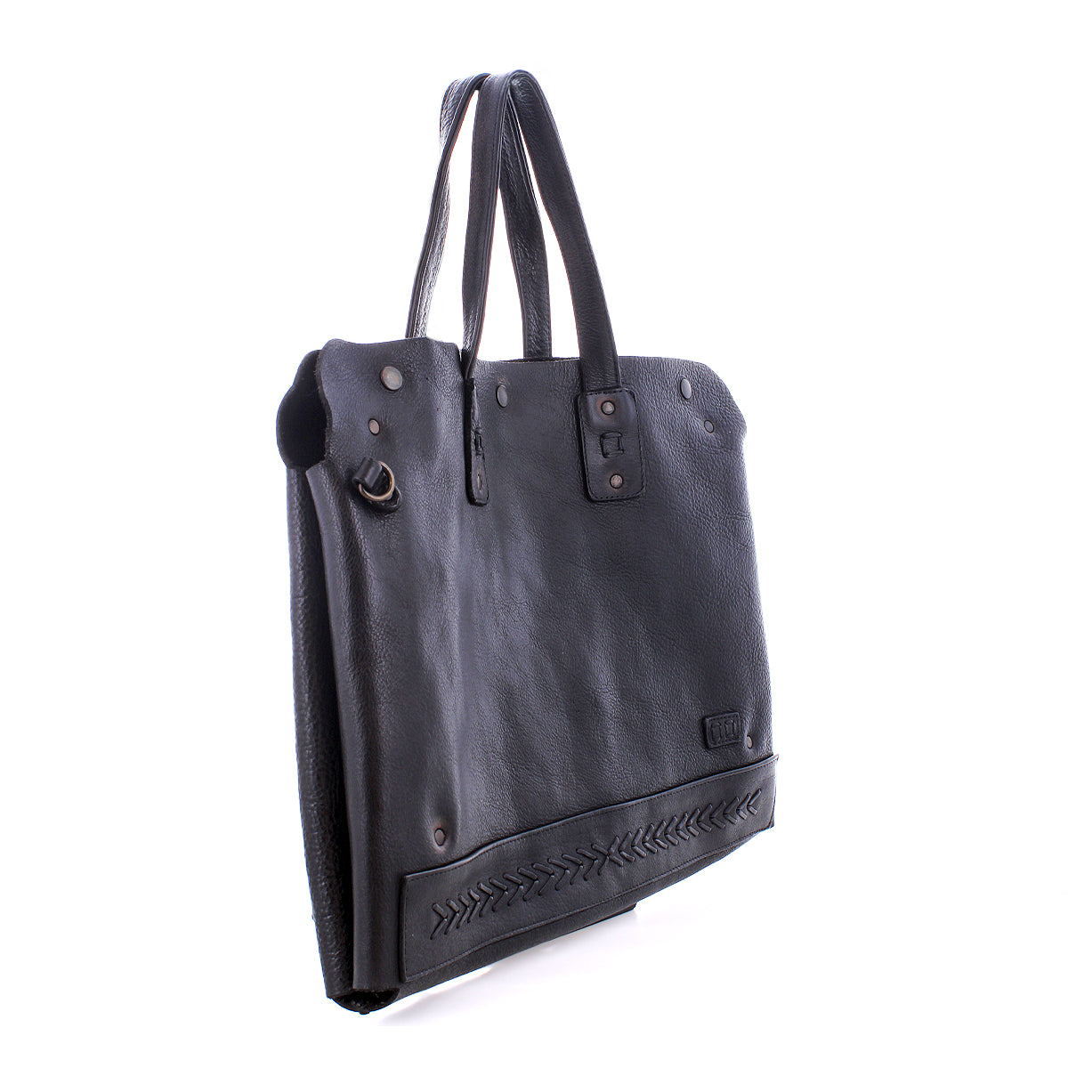The Bed|Stü Commuter is a black leather tote bag with two handles, decorative stitching near the base, and metal hardware accents, shown on a white background. Perfect as a mobile office or commuter bag, it blends style and practicality for your on-the-go lifestyle.