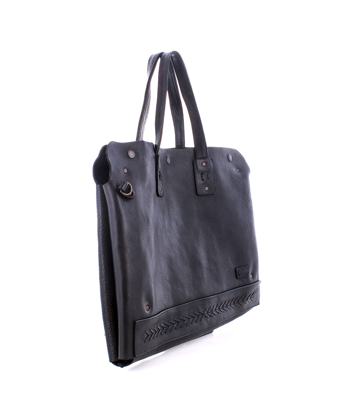 The Bed|Stü Commuter is a black leather tote bag with two handles, decorative stitching near the base, and metal hardware accents, shown on a white background. Perfect as a mobile office or commuter bag, it blends style and practicality for your on-the-go lifestyle.