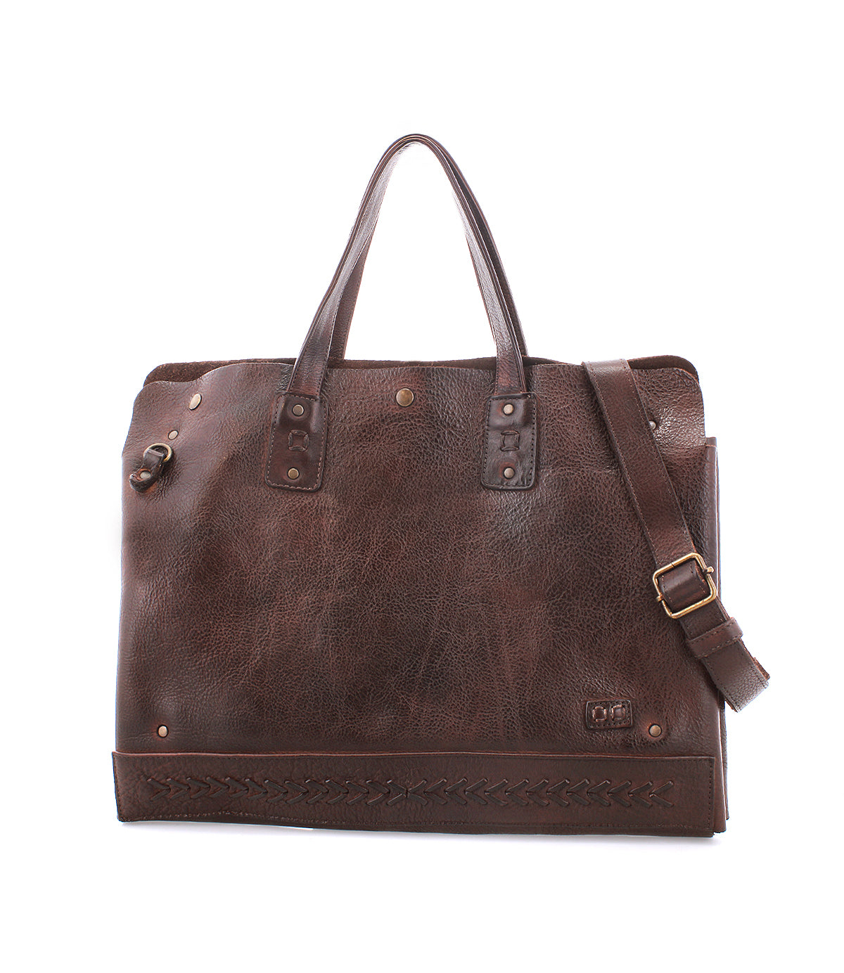 The Bed|Stü Commuter is a brown leather tote bag featuring dual handles, a detachable shoulder strap, brass hardware, and decorative stitching along the bottom edge—ideal as a stylish commuter bag or an elegant laptop bag for your everyday needs.