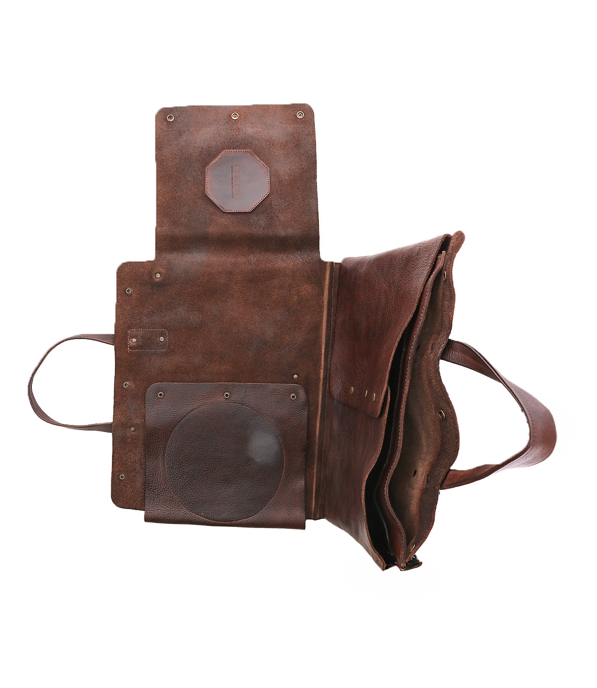 The Bed|Stü Commuter, a brown leather tote bag, is pictured open to reveal its interior pockets and compartments, with handles lying flat and sides folded outward—making it the ideal laptop bag for anyone needing a stylish mobile office companion for daily commutes.