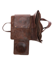 Showcasing the Bed|Stü Commuter bag in brown leather, this flap-top design opens to reveal multiple compartments and pockets—expertly crafted to serve as a stylish mobile office bag, all presented on a clean white background.