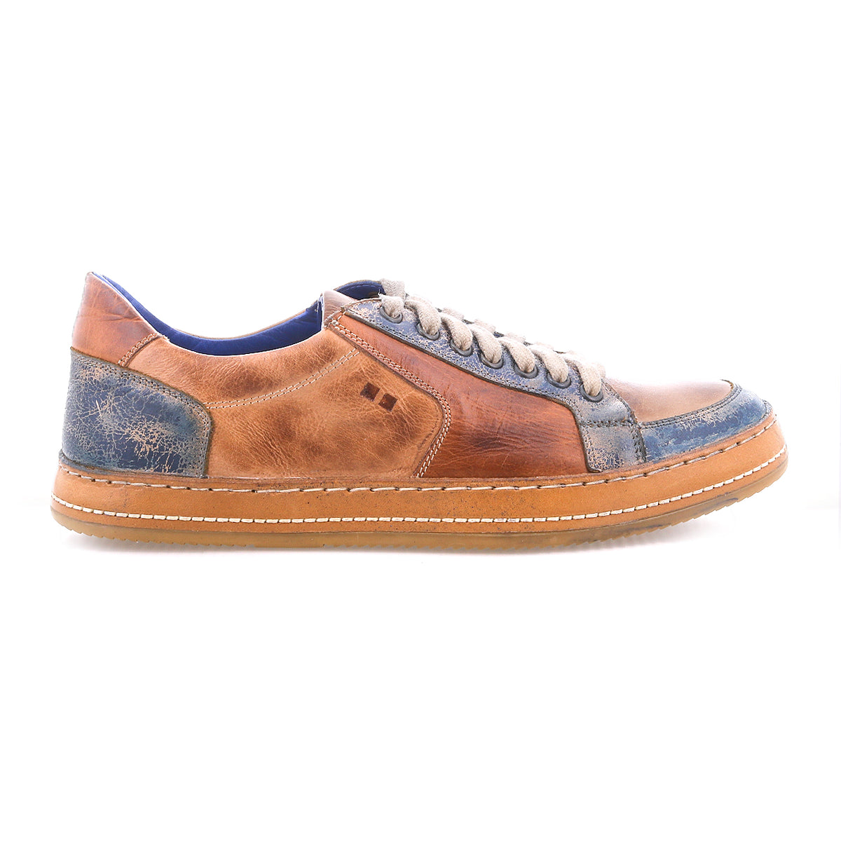 The Bed|Stü Condor sneaker features brown and blue leather with beige laces, white stitching, a durable rubber sole, and a blue inner lining for comfort. Shown in a left side view on a white background.