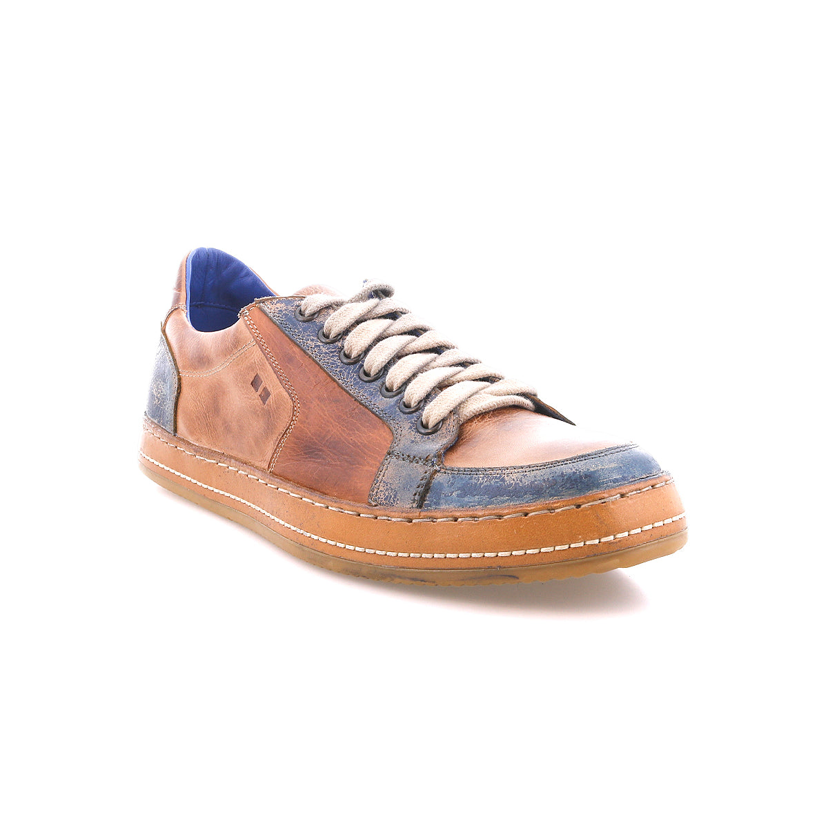The Bed|Stü Condor is a brown and blue casual leather sneaker featuring white laces and a durable rubber sole, photographed on a white background to highlight its comfortable fit and quality construction.
