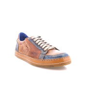 The Bed|Stü Condor is a brown and blue casual leather sneaker featuring white laces and a durable rubber sole, photographed on a white background to highlight its comfortable fit and quality construction.