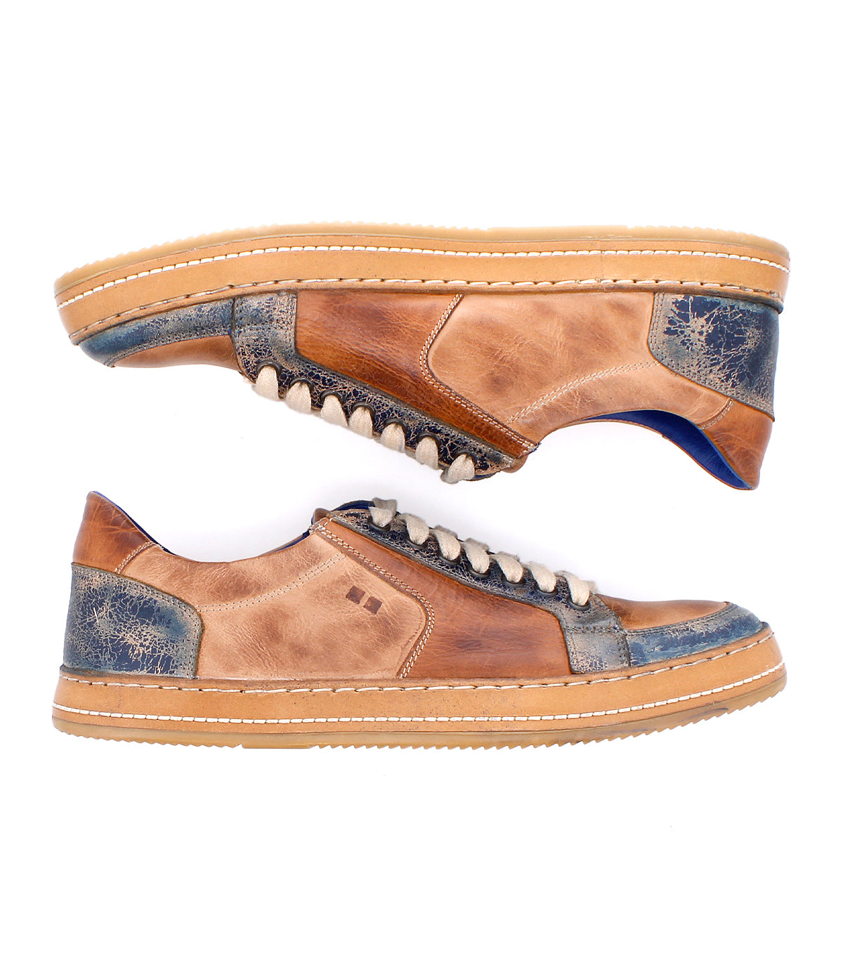 A pair of Bed|Stü Condor sneakers in brown and blue leather with beige laces and tan rubber soles, crafted for durable everyday wear, are displayed side by side against a white background.