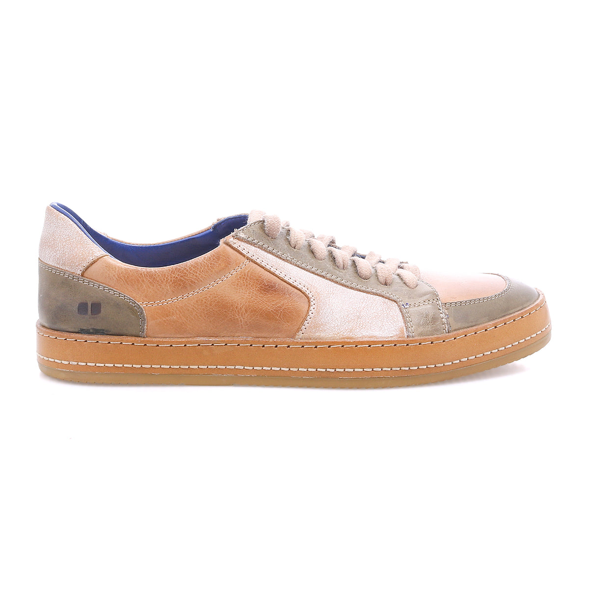 The Bed|Stü Condor is a casual, comfortable leather sneaker featuring a tan, beige, and olive green leather upper, beige laces, and a light brown rubber sole with durable construction. It is shown in side profile on a white background.