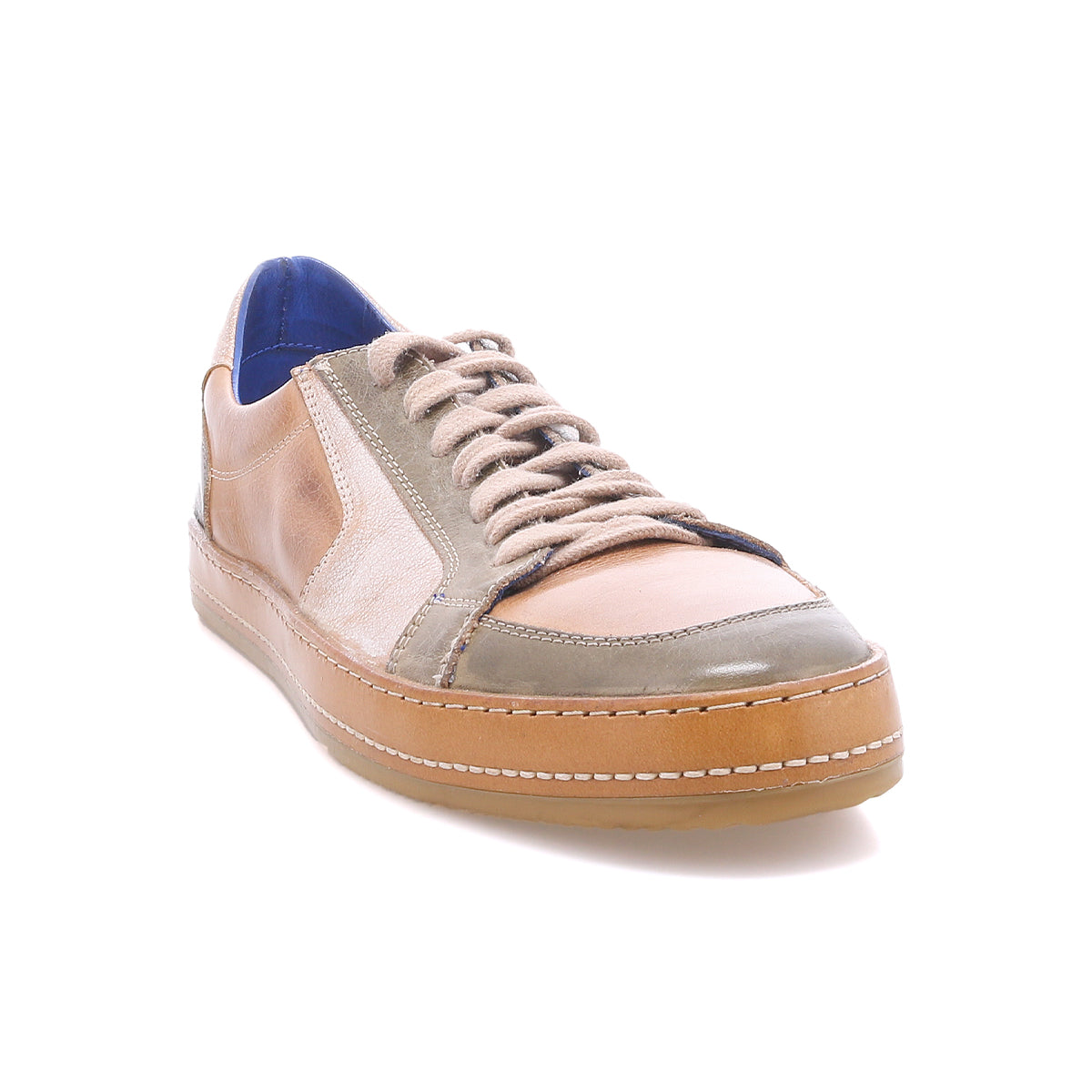 The Bed|Stü Condor is a tan and gray leather sneaker featuring brown laces, white stitching, and a gum rubber sole. Crafted with durable construction for long-lasting wear, it is shown on a white background.