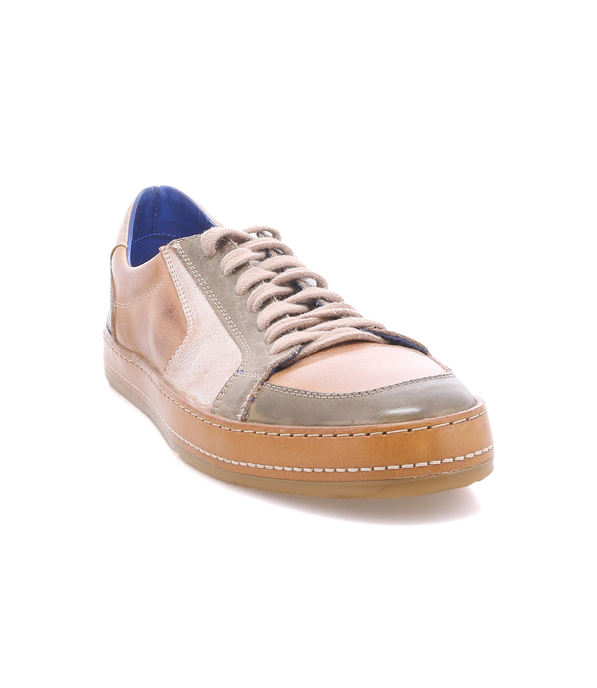 The Bed|Stü Condor is a tan and gray leather sneaker featuring brown laces, white stitching, and a gum rubber sole. Crafted with durable construction for long-lasting wear, it is shown on a white background.