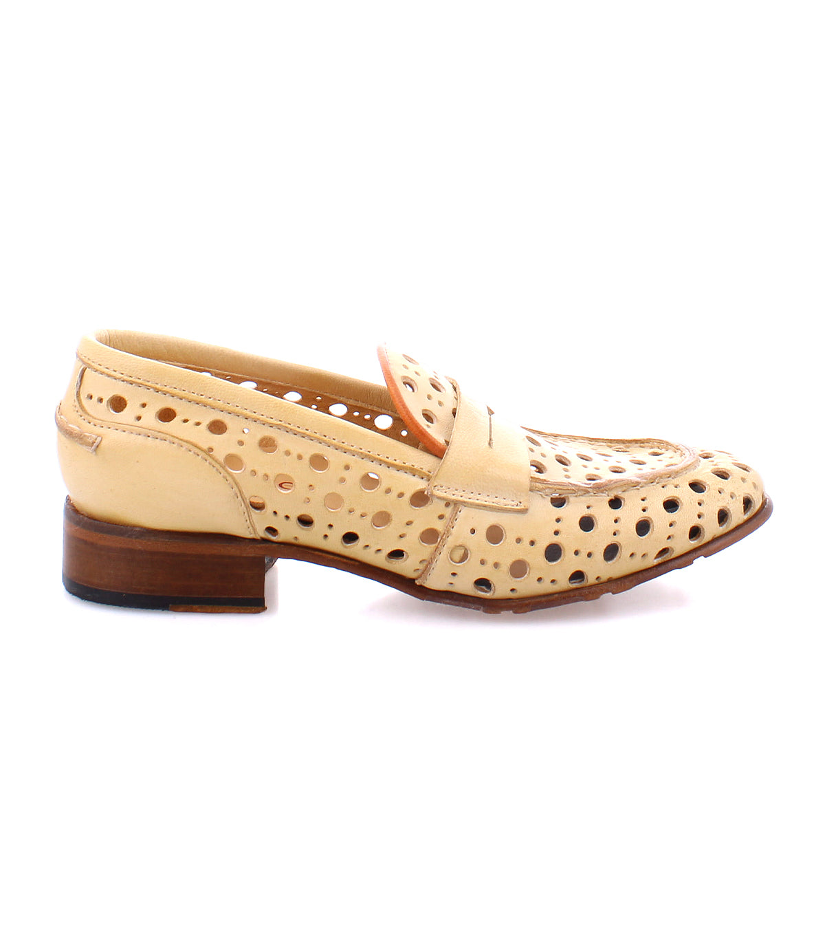 The Cornflower by Bed|Stü is a beige leather penny loafer featuring numerous circular cutouts and a low wooden heel, displayed in profile against a white background to highlight the refined elegance of these women's loafers, expertly handcrafted in Italy.