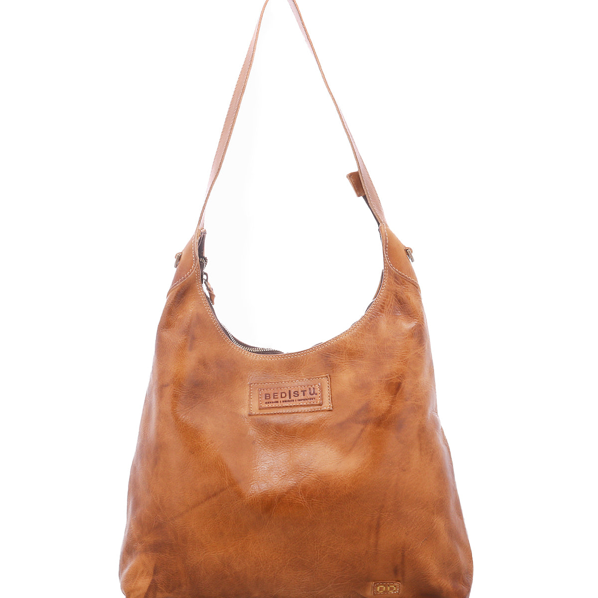 Crafted by Bed|Stü, the Dallas LTC is a tan leather shoulder bag with a single strap and visible stitching, highlighted by a rectangular embossed logo patch on the front—a holster-inspired design that seamlessly combines classic style and practical function.