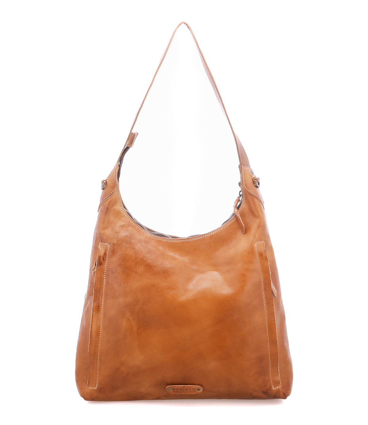 The Bed|Stü Dallas LTC is a tan leather shoulder bag designed for versatility, featuring a single strap and zippered opening. Shown against a plain white background, this concealed carry accessory effortlessly combines style with practical security.