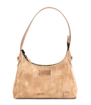 The Denton by Bed|Stü is a small beige bag, expertly crafted from vegetable-tanned leather with an embossed logo on the front, a single shoulder strap, and a zip-top closure.