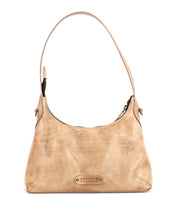 Beige leather shoulder bag, the Denton by Bed|Stü, crafted from premium vegetable-tanned leather and featuring a single strap, secure zip-top closure, and a metal logo plate on the front. This elegant small bag is perfect for carrying your everyday essentials.