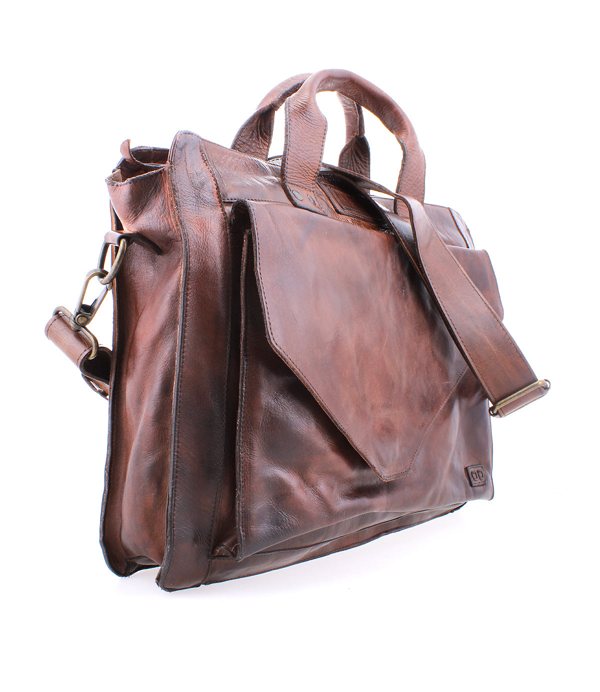 The Bed|Stü Depp is a brown leather messenger bag featuring a front flap pocket, dual handles, multiple organized compartments for easy storage, and an adjustable shoulder strap, shown against a white background.