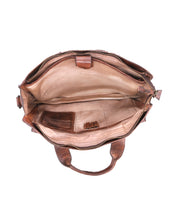 The Bed|Stü Depp handbag in rich brown leather is shown from above, revealing a spacious beige interior with organized compartments—including multiple pockets, pen holders, and a zippered section. Two handles and an adjustable shoulder strap are also visible at the base.