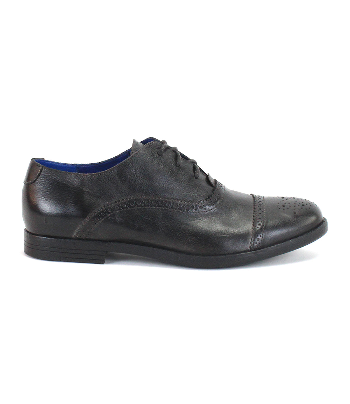 The Donatello II by Bed|Stü is a black leather oxford dress shoe featuring brogue detailing, a cap-toe design, and a black sole, all crafted from premium vegetable-tanned leather, shown here in a side profile view.