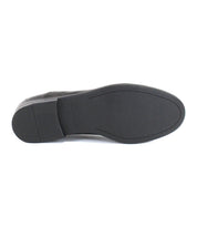 The image shows the bottom view of the Bed|Stü Donatello II oxford shoe in black, featuring a smooth, flat rubber sole with minimal tread and a small heel.