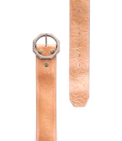 The Bed|Stü Dreampath EM is a wide tan genuine leather belt featuring embossed floral patterns, a large octagonal silver buckle, and two brass rivets. Displayed both buckled and flat against a white background, this modern belt offers timeless elegance paired with rugged durability.