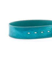A Bed|Stü Dreampath teal leather belt with white stitching and four rectangular holes, featuring an octagon metal buckle, shown on a white background.