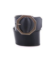Bed|Stü's "Dreampath" genuine leather belt, coiled neatly against a white background and featuring a striking octagon brass buckle.