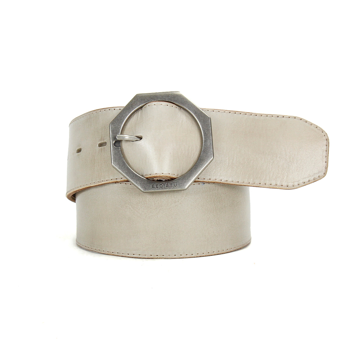 Wide beige Bed|Stü Dreampath genuine leather belt featuring an octagon metal buckle, pictured rolled up with the end looped through the buckle.