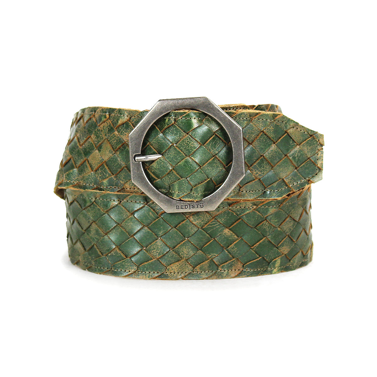 The Bed|Stü Dreamweaver, a green woven leather belt featuring artisan craftsmanship and a silver octagonal metal buckle, is coiled on a white background.