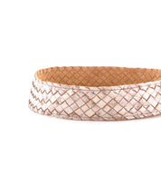 The Dreamweaver basket by Bed|Stü features a white and brown woven design with a flat base, showcased against a plain white background, highlighting artisan craftsmanship and bringing a touch of bohemian style to any space.