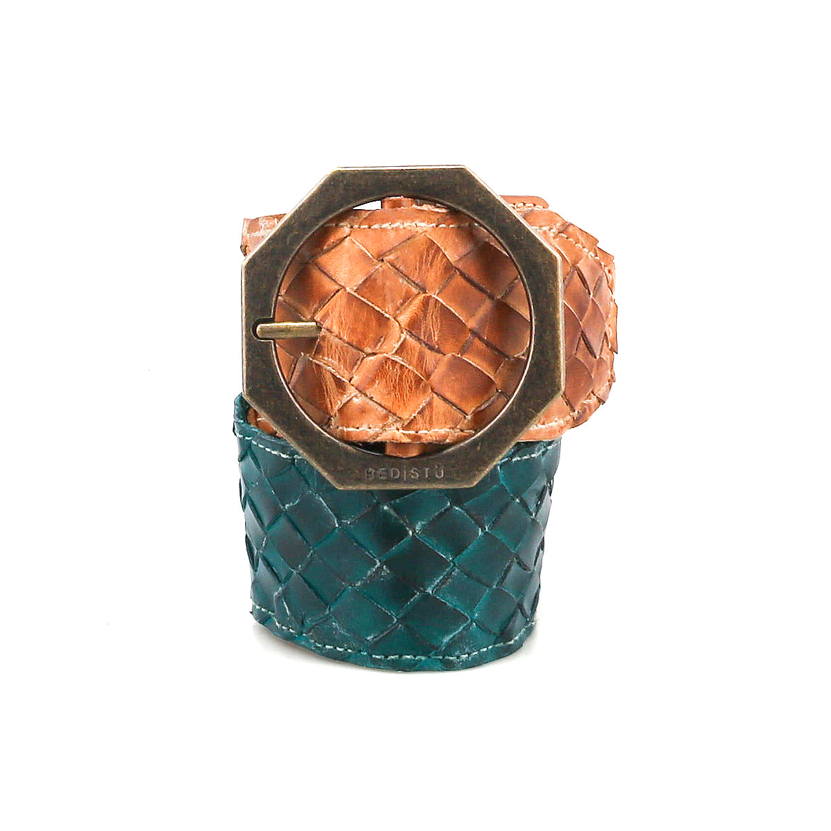 The Dreamweaver cuff bracelet by Bed|Stü showcases artisan craftsmanship with wide woven leather in tan and teal sections, accented by a large octagonal brass buckle for a distinct bohemian style.
