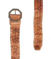 Two views of the Bed|Stü Dreamweaver, a brown woven leather belt featuring an octagonal metal buckle, are shown flat against a white background to showcase its artisan craftsmanship.