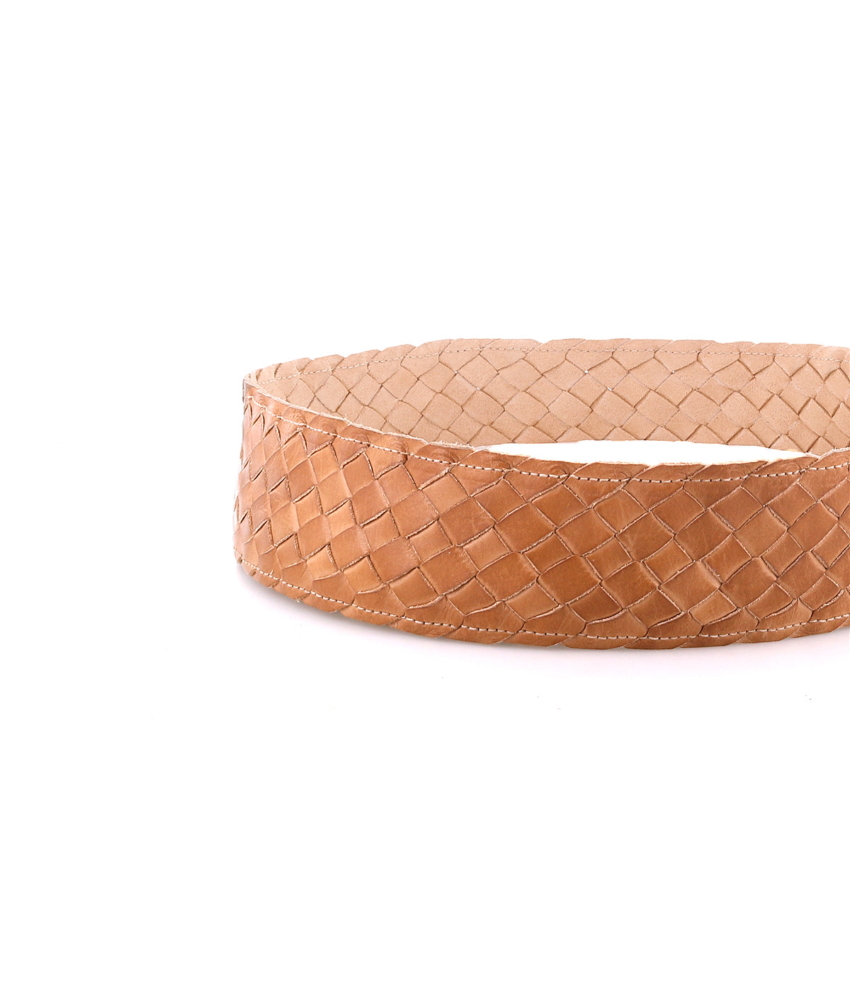 The Bed|Stü Dreamweaver belt, crafted from light brown woven leather that highlights artisan craftsmanship, is displayed in a circular shape against a white background.