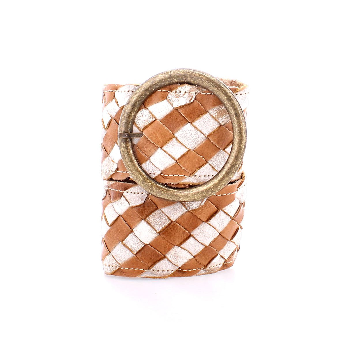 The Dreamweaver belt by Bed|Stü features artisan craftsmanship in its brown and white woven leather design, finished with a large round metal buckle, and is shown rolled up against a white background.