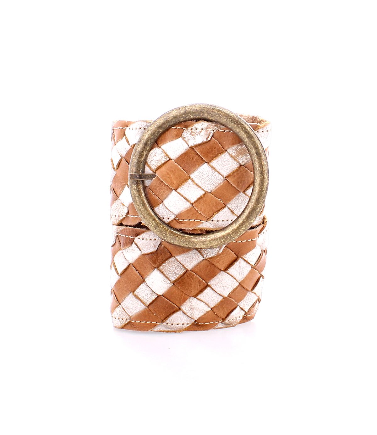 The Dreamweaver belt by Bed|Stü features artisan craftsmanship in its brown and white woven leather design, finished with a large round metal buckle, and is shown rolled up against a white background.