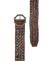 The Bed|Stü Dreamweaver brown woven leather belt, featuring artisan craftsmanship and a geometric metal buckle for a bohemian touch, is shown on a white background with both the buckle end and the tapered tip visible.