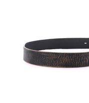 A partial view of the Bed|Stü Drifter belt in dark brown leather with a distressed, textured finish and a metal buckle, showcasing a minimal style against a white background.