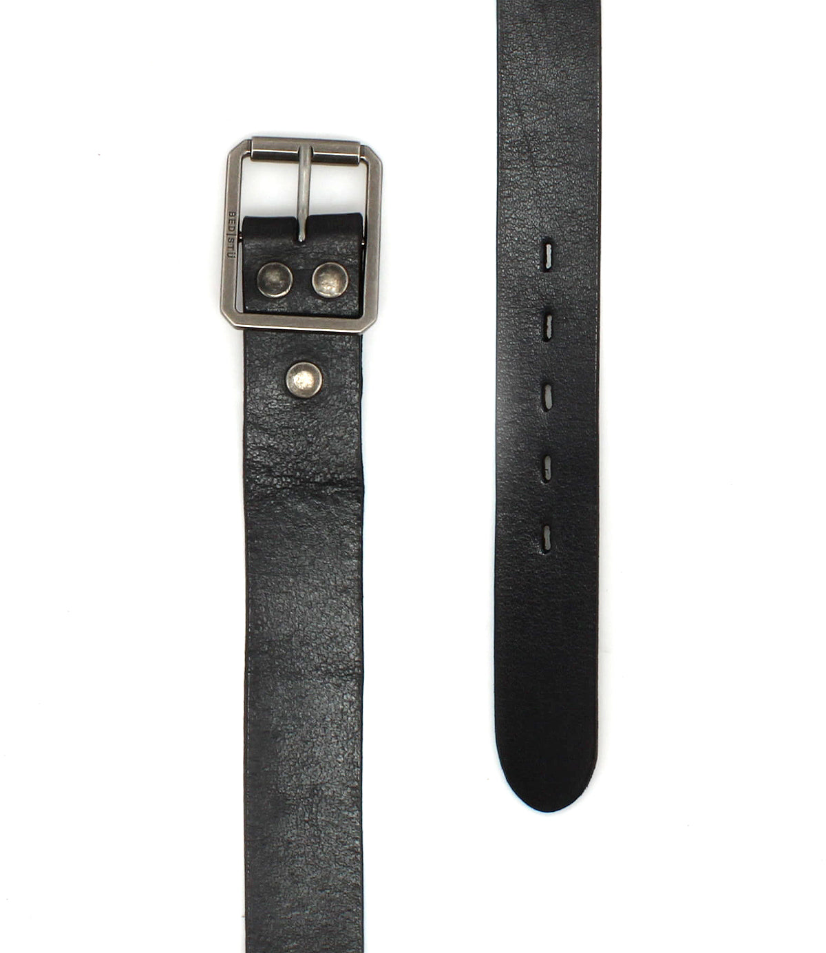 The Drifter belt by Bed|Stü is featured against a white background, showcasing its black textured leather strap with a metal buckle, two metal studs, and multiple adjustment holes. Its minimal design and refined craftsmanship make this versatile accessory an elegant addition to any wardrobe.