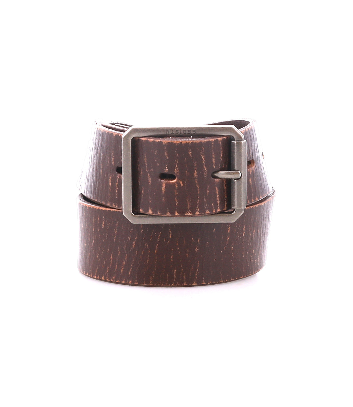 Showcased coiled to display its detailed pattern, the Drifter belt by Bed|Stü features a brown textured leather strap and a silver metal buckle, enhancing its minimal style.