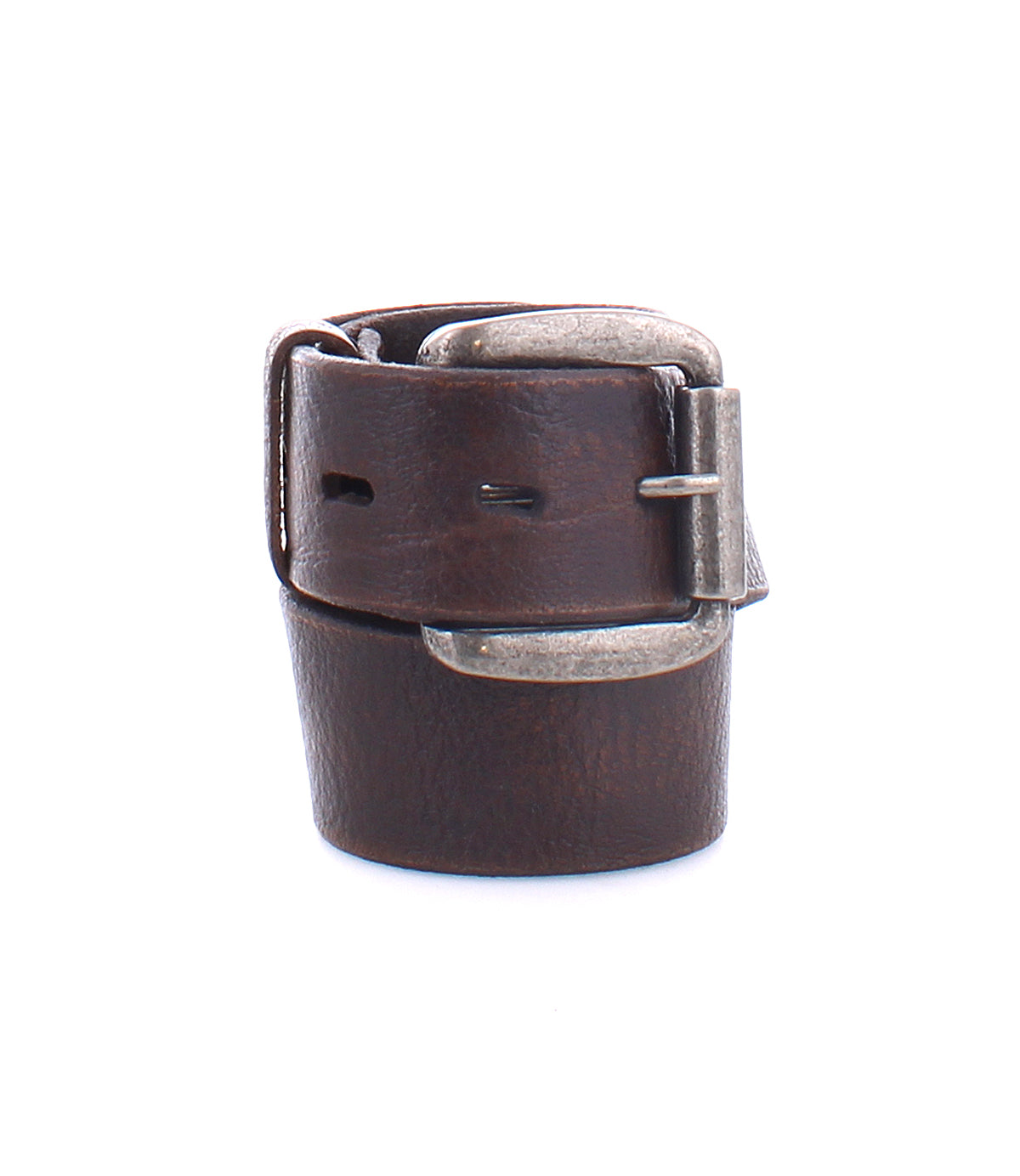 The Drifter belt by Bed|Stü is shown coiled against a white background, featuring a textured dark brown leather strap and a silver metal buckle in a minimal style.