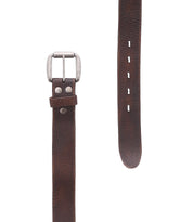The Drifter belt by Bed|Stü is crafted from brown textured leather in a minimal style, featuring a metal buckle, decorative metal rivets, and multiple holes for size adjustment.