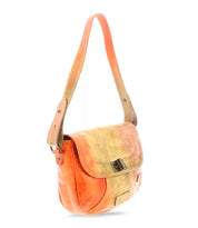 The Elect by Bed|Stü is an orange and yellow gradient leather shoulder bag featuring a front flap, buckle closure, and adjustable strap, showcased on a white background—a perfect blend of vintage charm and everyday practicality.