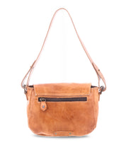 The Bed|Stü Elect is a light brown leather shoulder bag with a front zipper pocket, flap closure, and an adjustable strap. Featuring vintage charm and perfect for everyday use, it is displayed against a white background.