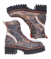A pair of Bed|Stü Elisha Hi distressed brown leather lace-up boots, featuring a classic lace-up profile with metal eyelets, rugged black soles, and distinctive red pull tabs, displayed from both the side and sole views.