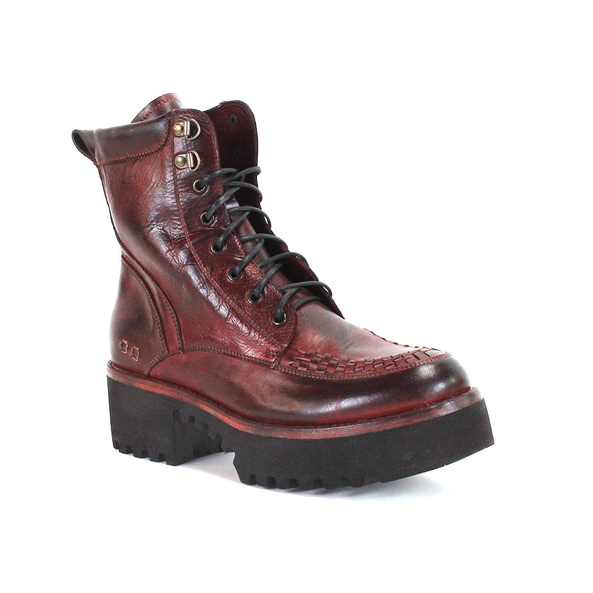 The Bed|Stü Elisha Hi is a single brown leather lace-up boot featuring visible stitching, a handwoven toe detail, and a thick black rugged sole, photographed on a white background.