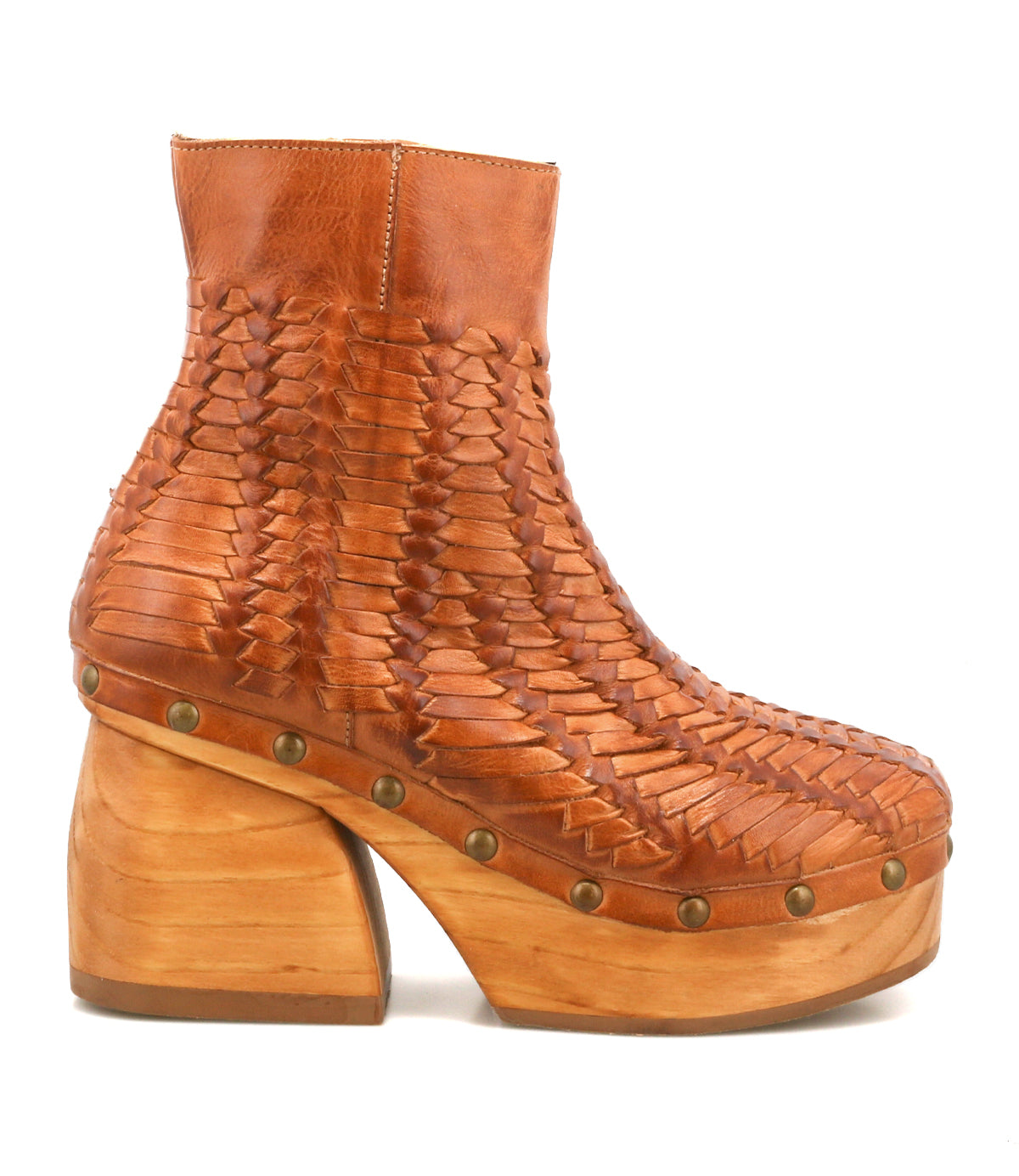 Introducing Ellasphin by Bed|Stü: These handwoven brown leather ankle boots feature a chunky wooden platform heel, brass stud accents along the sole, and a closed toe—making them the epitome of artisan fashion.