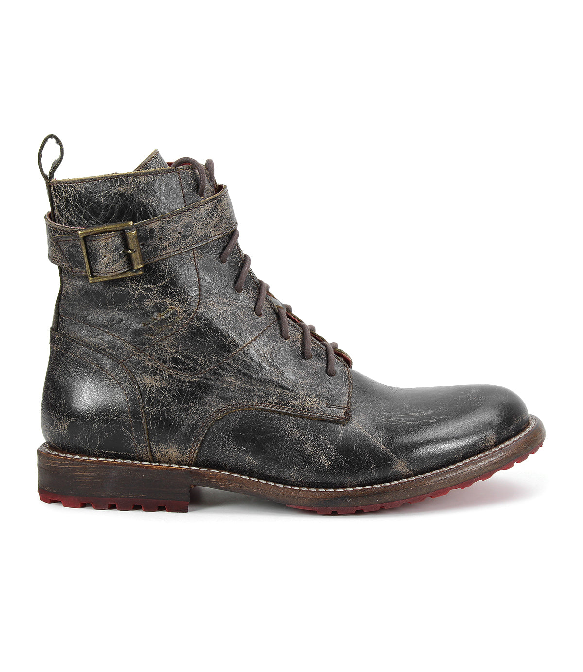 The Bed|Stü Endure boot is a single distressed black leather lace-up with a buckle strap, brown sole, durable treaded outsole, and slight heel, shown in a left side profile against a white background.