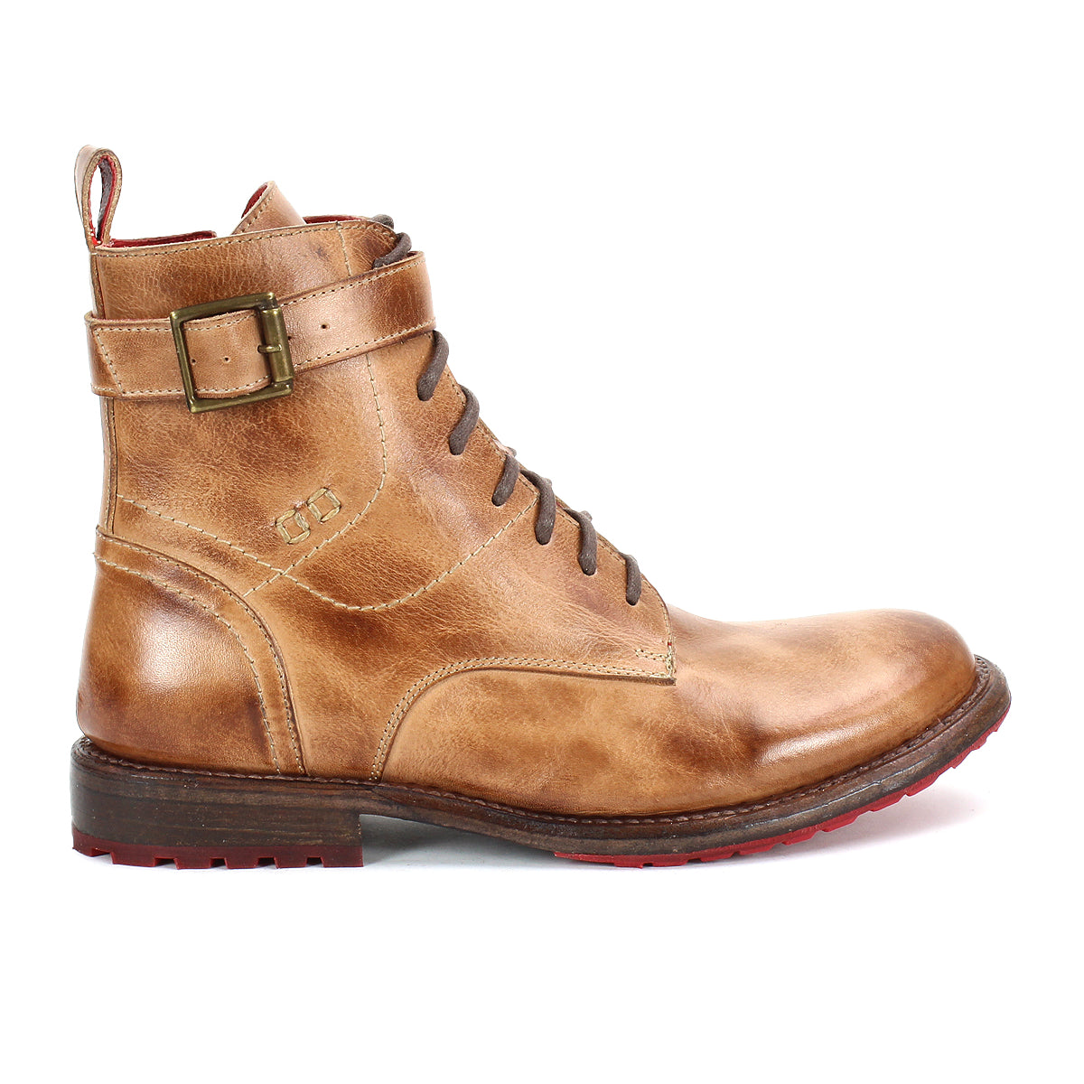 The Bed|Stü Endure is a brown leather lace-up boot with a side buckle and low heel, featuring a durable treaded outsole for reliable grip. Shown in profile against a white background, these rugged ankle strap boots stand out with their bold red tread for striking contrast.