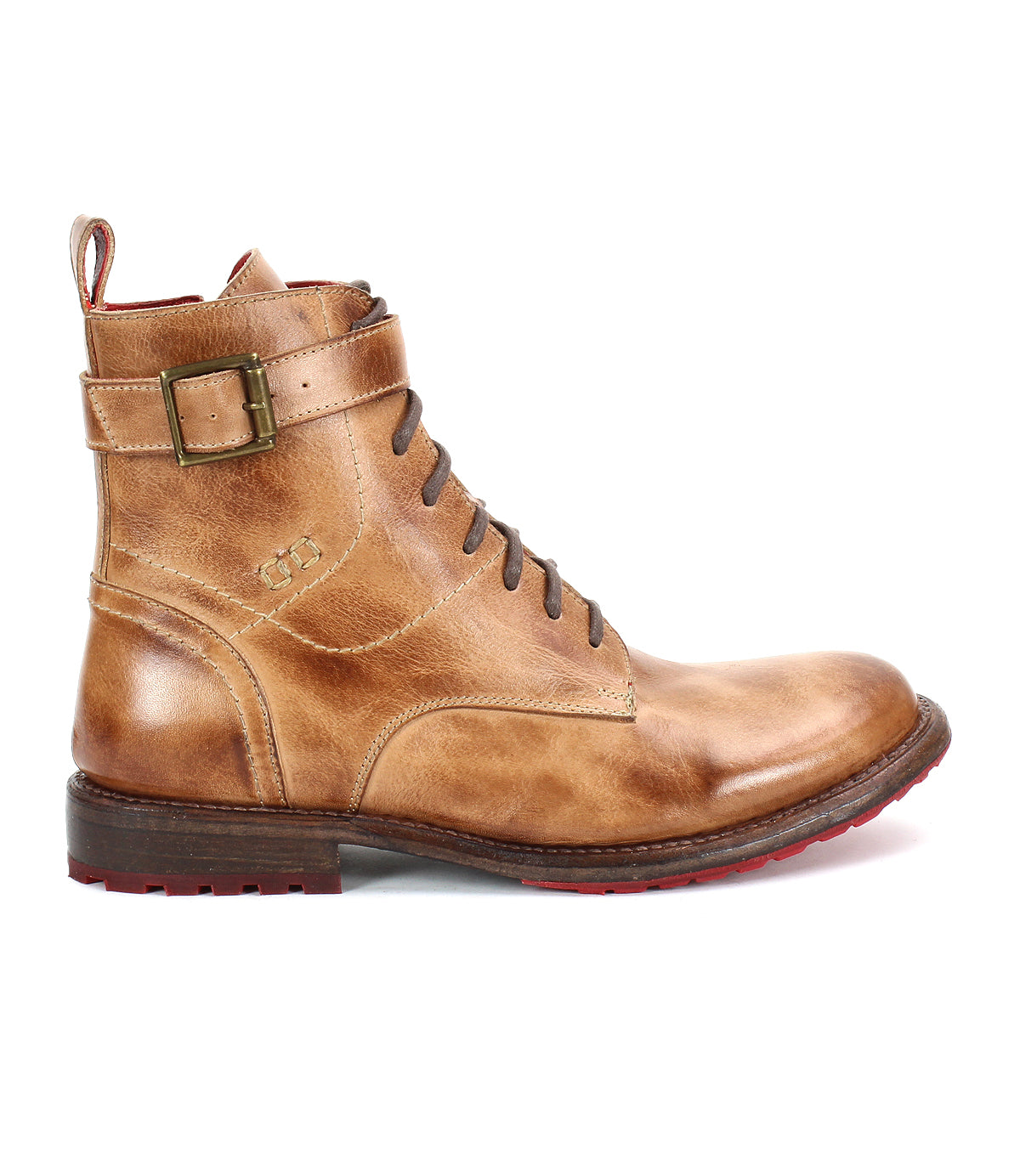 The Bed|Stü Endure is a brown leather lace-up boot with a side buckle and low heel, featuring a durable treaded outsole for reliable grip. Shown in profile against a white background, these rugged ankle strap boots stand out with their bold red tread for striking contrast.
