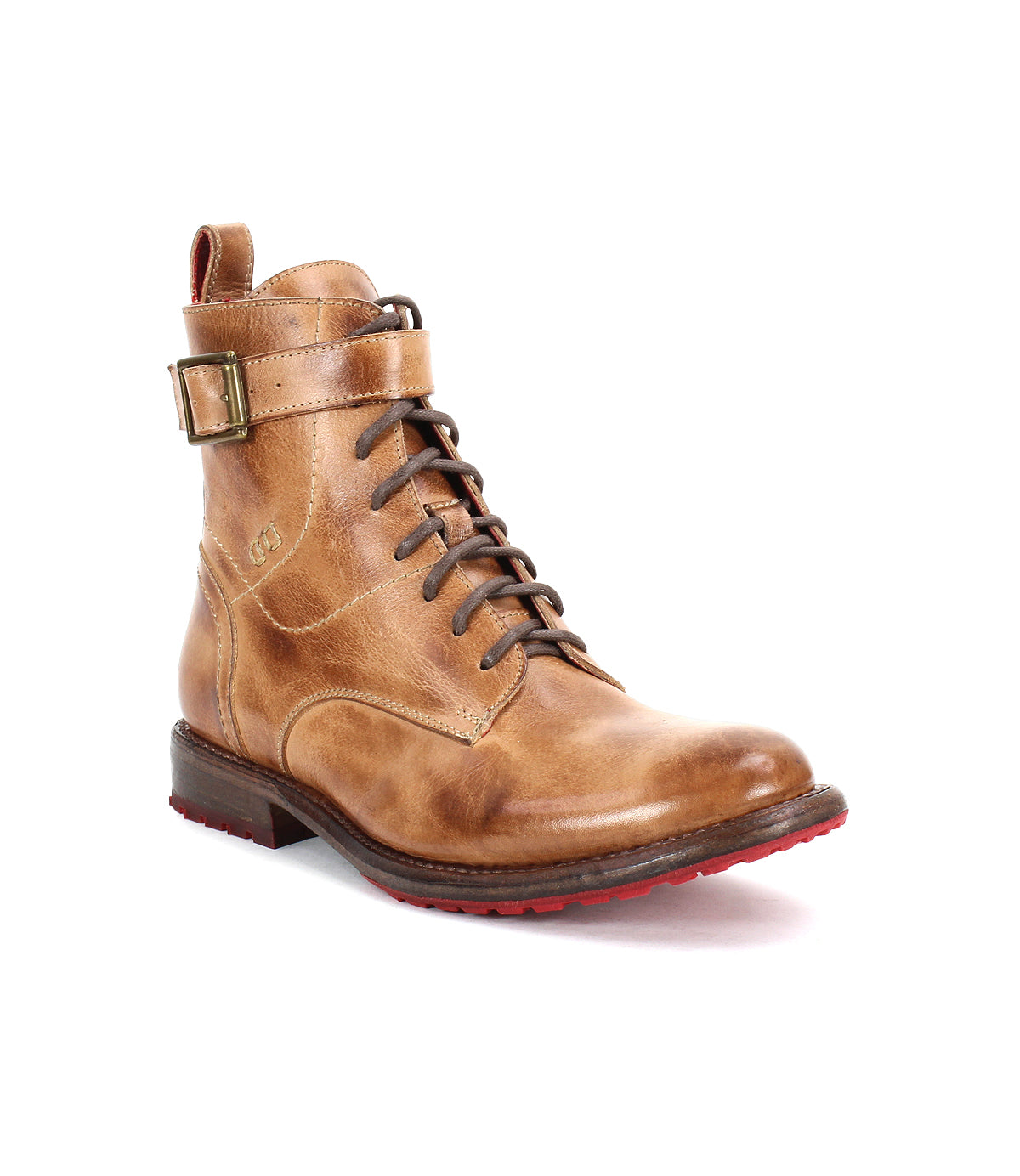 The Bed|Stü Endure is a brown leather lace-up boot with a side buckle, low heel, and red sole accents, featuring a durable treaded outsole for enhanced grip and longevity, photographed on a white background.