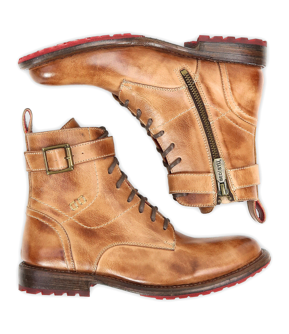A pair of Bed|Stü Endure tan rugged leather lace-up ankle boots with side zippers, buckles, and red durable treaded outsoles, displayed side by side on a white background.